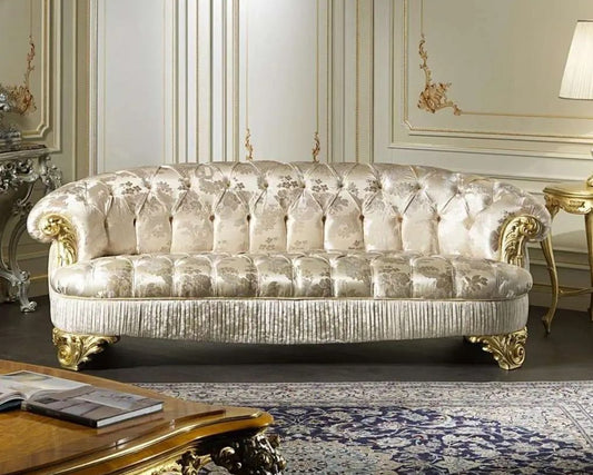 Luxurious sofa in a classical living room with ornate decor.